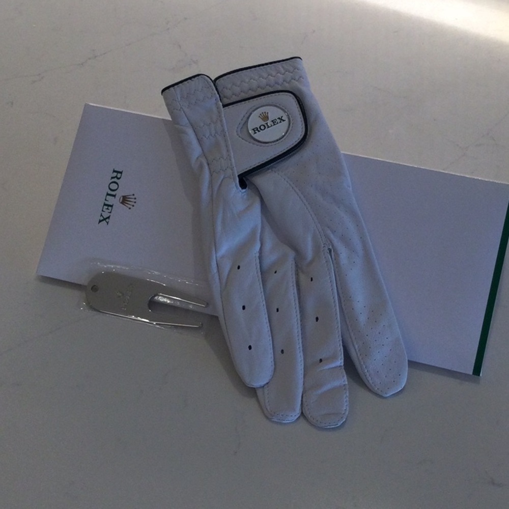 Rolex golf glove with divot tool